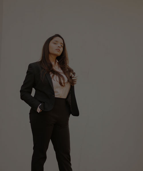 Woman in suits looking at the camera